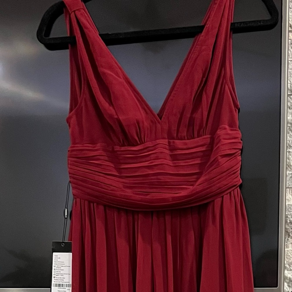 Ever pretty size 4 evening gown. Never worn, new with tags.